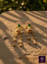 Floral pink and green long dangler jhumka earrings with gold finish, anti-tarnish artificial jewellery for women