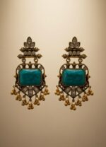 Vintage chandbali drop earrings with turquoise blue rectangular gemstone, antique gold finish, kundan stones, and small dangling gold beads on a white background.