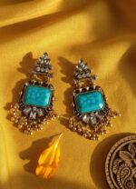 Vintage chandbali drop earrings with turquoise blue rectangular gemstone, antique gold finish, kundan stones, and small dangling gold beads on a white background.